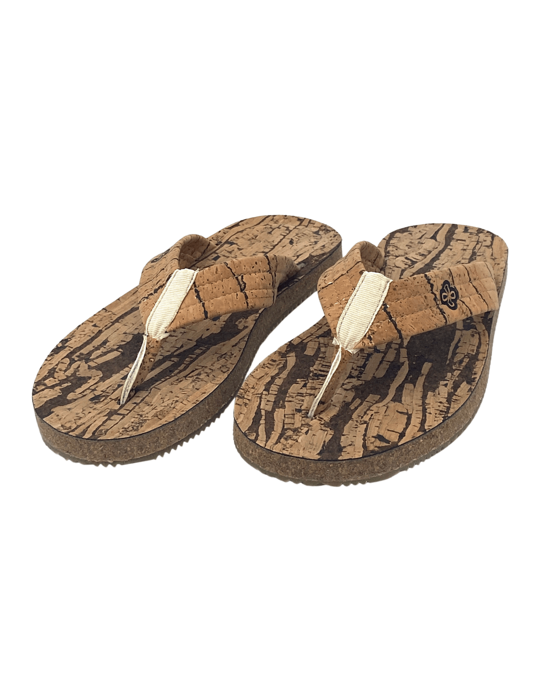 Side view of natural cork flip flop on white background, showing cork footbed and recycled rubber sole