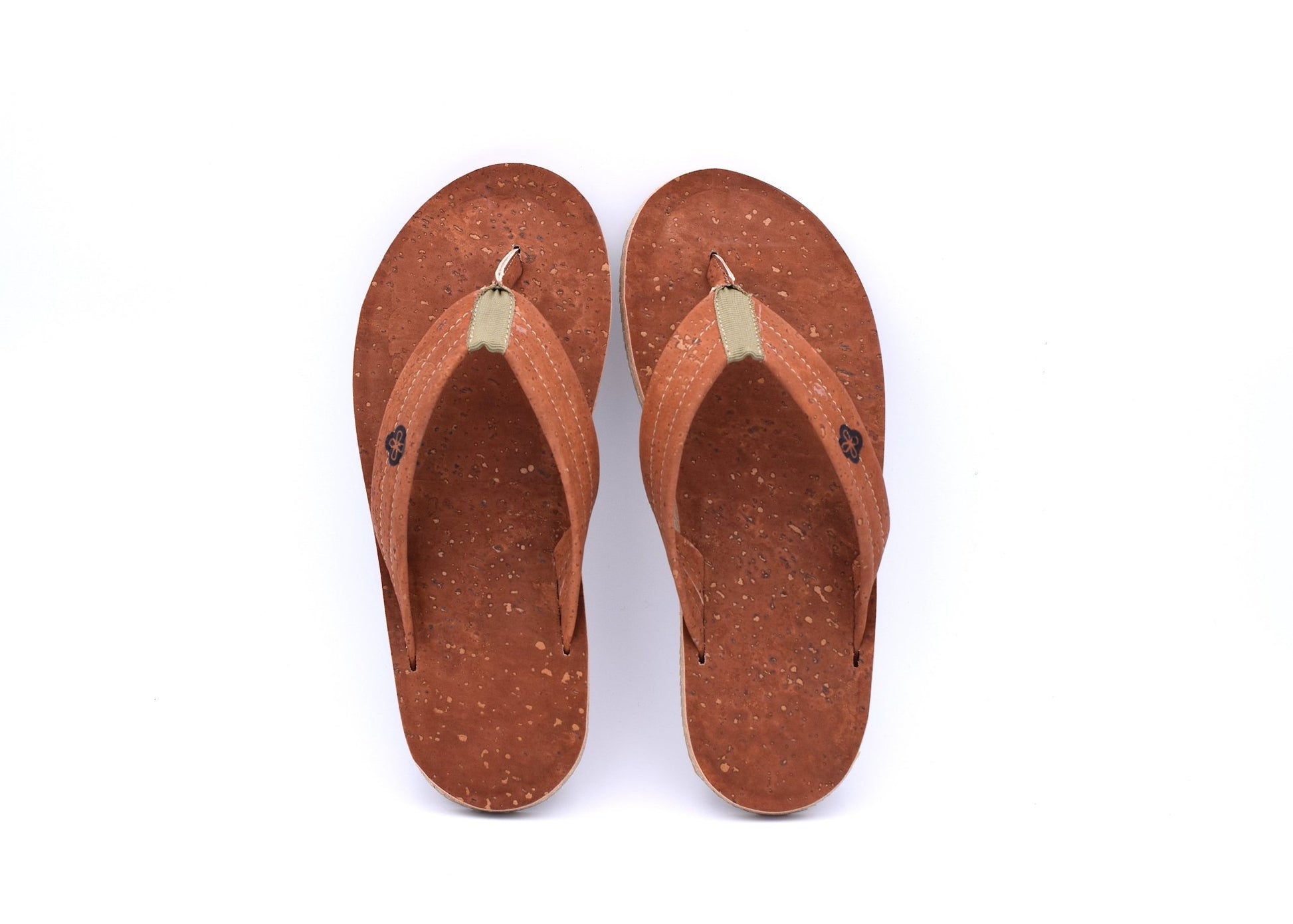 Top view on white background of coffee color cork sandal showing comfort and style