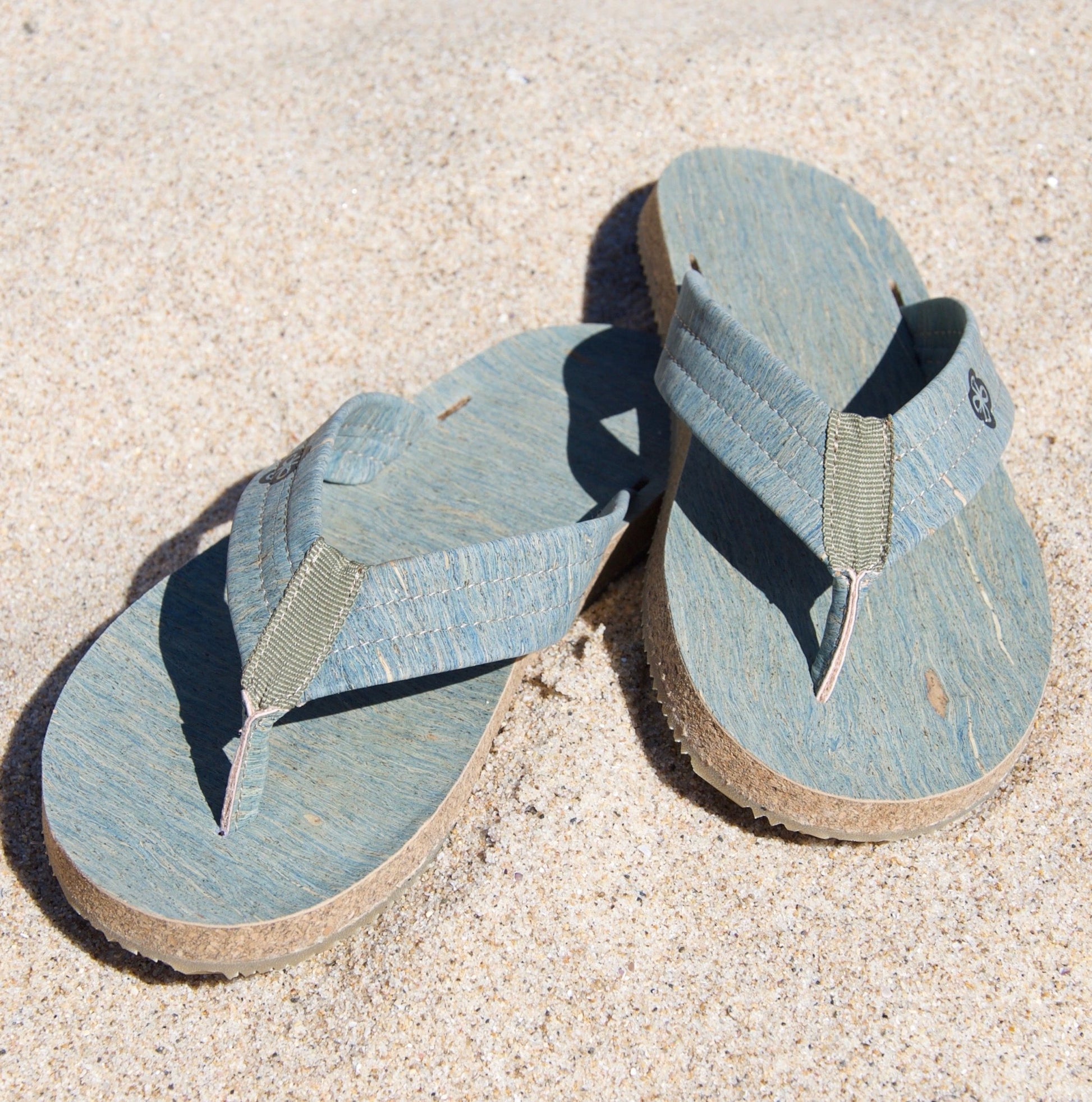 light blue cork sandals on beach front view